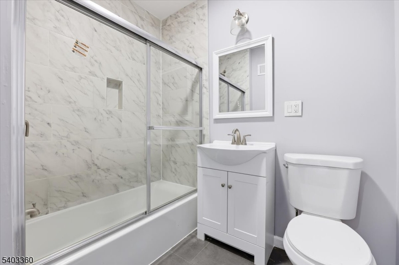 76 Riggs Place, Unit 2 West Orange, NJ 07052 - Photo 6 of 24 a bathroom with a toilet sink and bathtub
