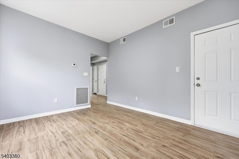 76 Riggs Place, Unit 2 West Orange, NJ 07052 - Photo 10 of 24 a view of an empty room with wooden floor