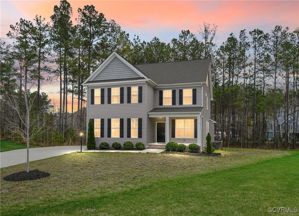 a front view of a house with a yard