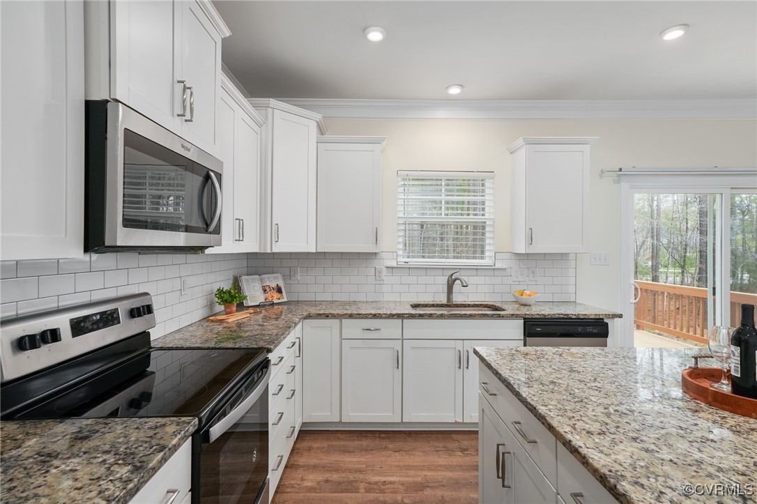 9019 Forge Gate Lane Chesterfield, VA 23832 - Photo 12 of 47 a kitchen with stainless steel appliances granite countertop a sink stove and cabinets