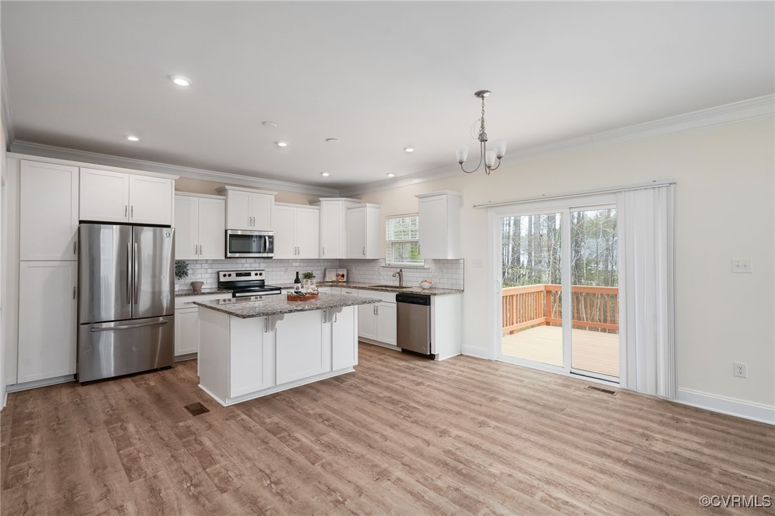 9019 Forge Gate Lane Chesterfield, VA 23832 - Photo 13 of 47 a kitchen with stainless steel appliances a refrigerator sink and cabinets