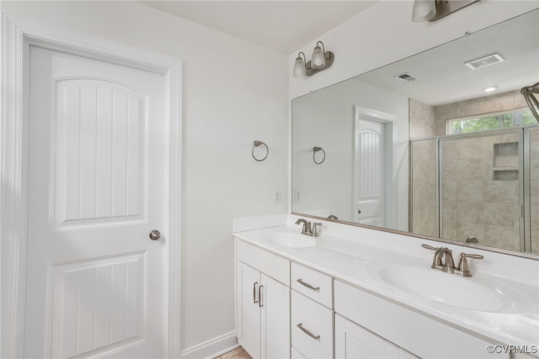 9019 Forge Gate Lane Chesterfield, VA 23832 - Photo 19 of 47 a bathroom with 2 sink and a mirror