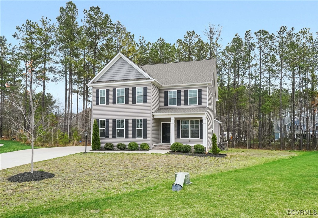 9019 Forge Gate Lane Chesterfield, VA 23832 - Photo 36 of 47 a front view of a house with a yard