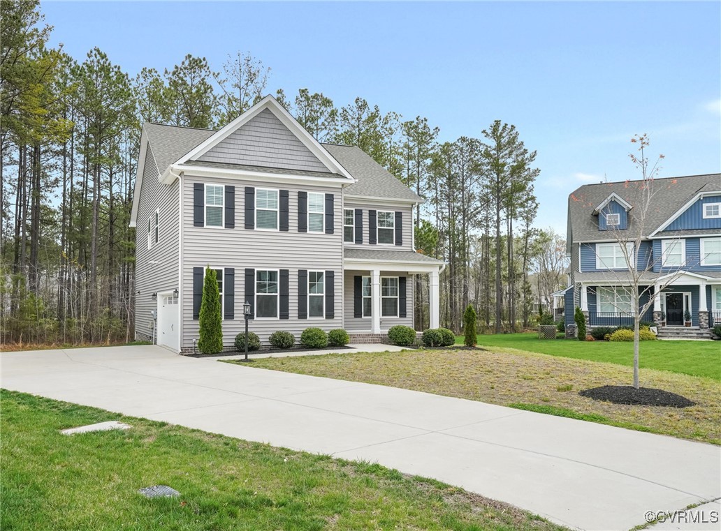 9019 Forge Gate Lane Chesterfield, VA 23832 - Photo 37 of 47 a front view of a house with a yard