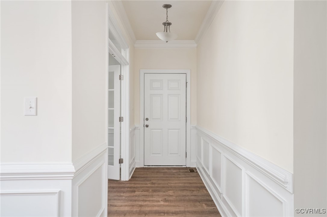 9019 Forge Gate Lane Chesterfield, VA 23832 - Photo 4 of 47 a view of a hallway with wooden floor and staircase