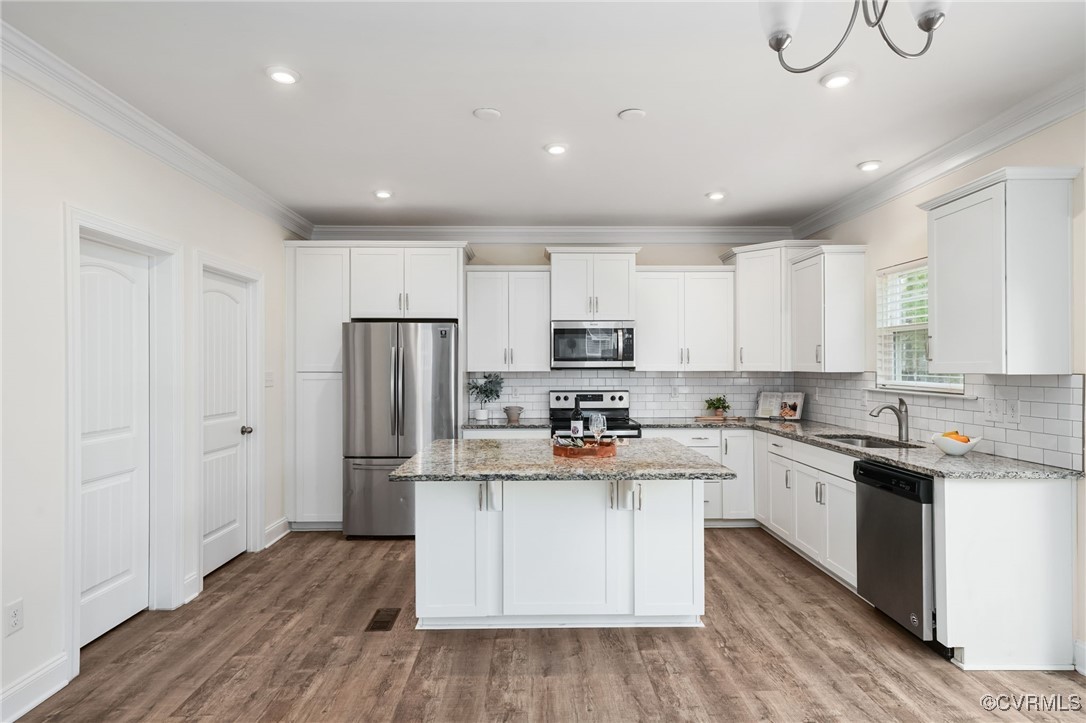 9019 Forge Gate Lane Chesterfield, VA 23832 - Photo 10 of 47 a kitchen with stainless steel appliances granite countertop a refrigerator a stove top oven a sink and dishwasher with wooden floor