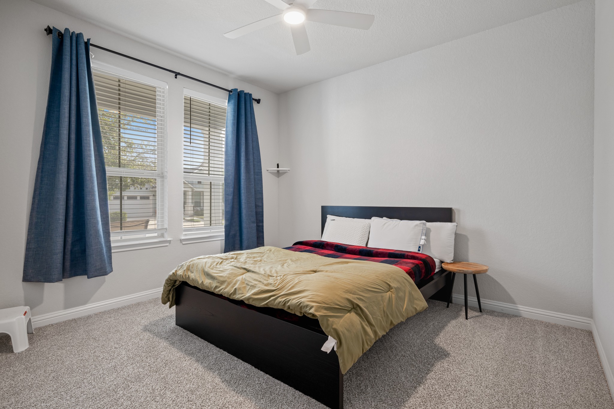8405 Hubble Walk Austin, TX 78744 - Photo 23 of 36 Carpeted bedroom featuring baseboards and ceiling fan