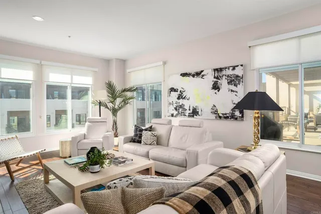 a living room with furniture and a large window