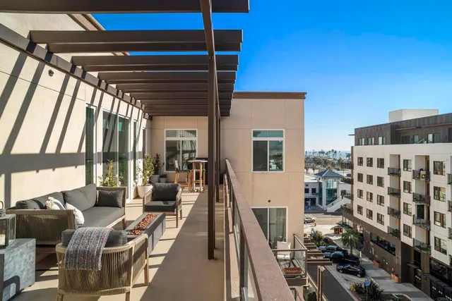 a view of a balcony with furniture