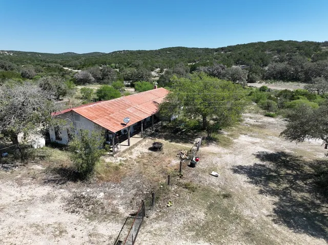 a view of a city with lush green forest