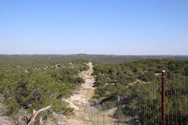 a view of a dry yard covered with snow