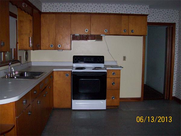 22 Maxdale Road Worcester, MA 01602 - Photo 4 of 5 a kitchen with granite countertop a stove top oven a sink and dishwasher