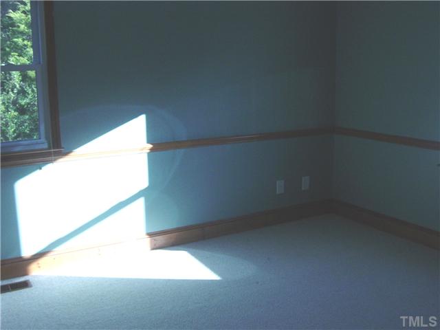 4603 West Lebanon Road Efland, NC 27243 - Photo 10 of 14 Both extra bedrooms have crown and chair rail molding.
