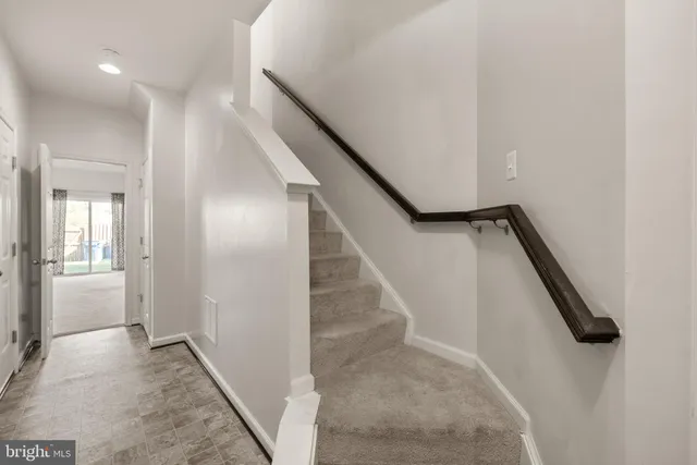 a view of a hallway with staircase