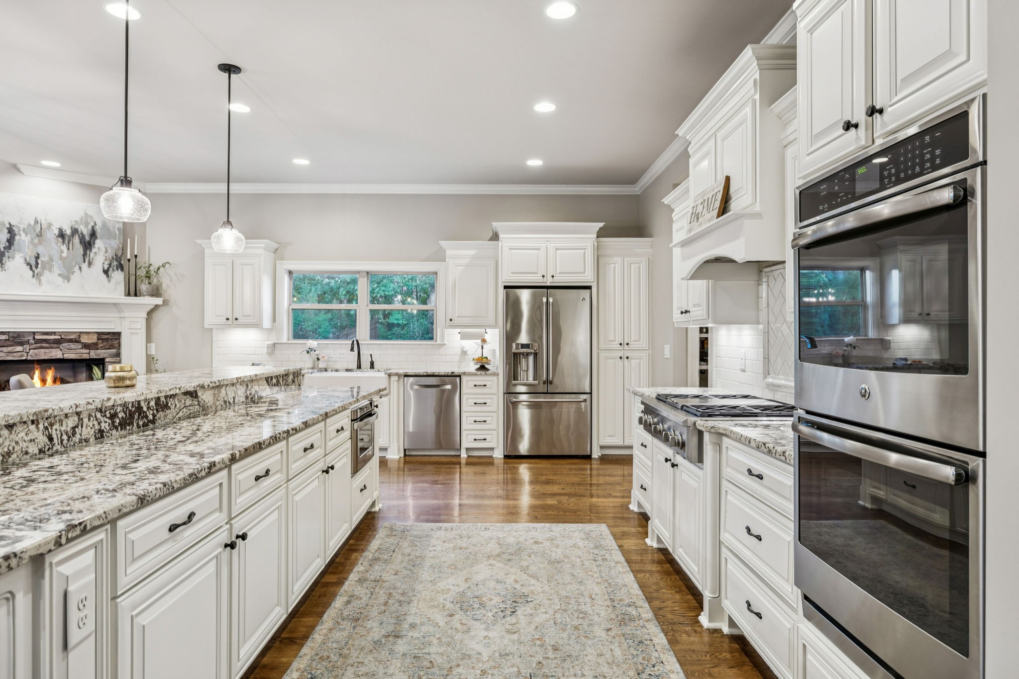 240 Laycrest Drive Mount Juliet, TN 37122 - Photo 30 of 100 a large kitchen with stainless steel appliances granite countertop a stove a sink and a refrigerator