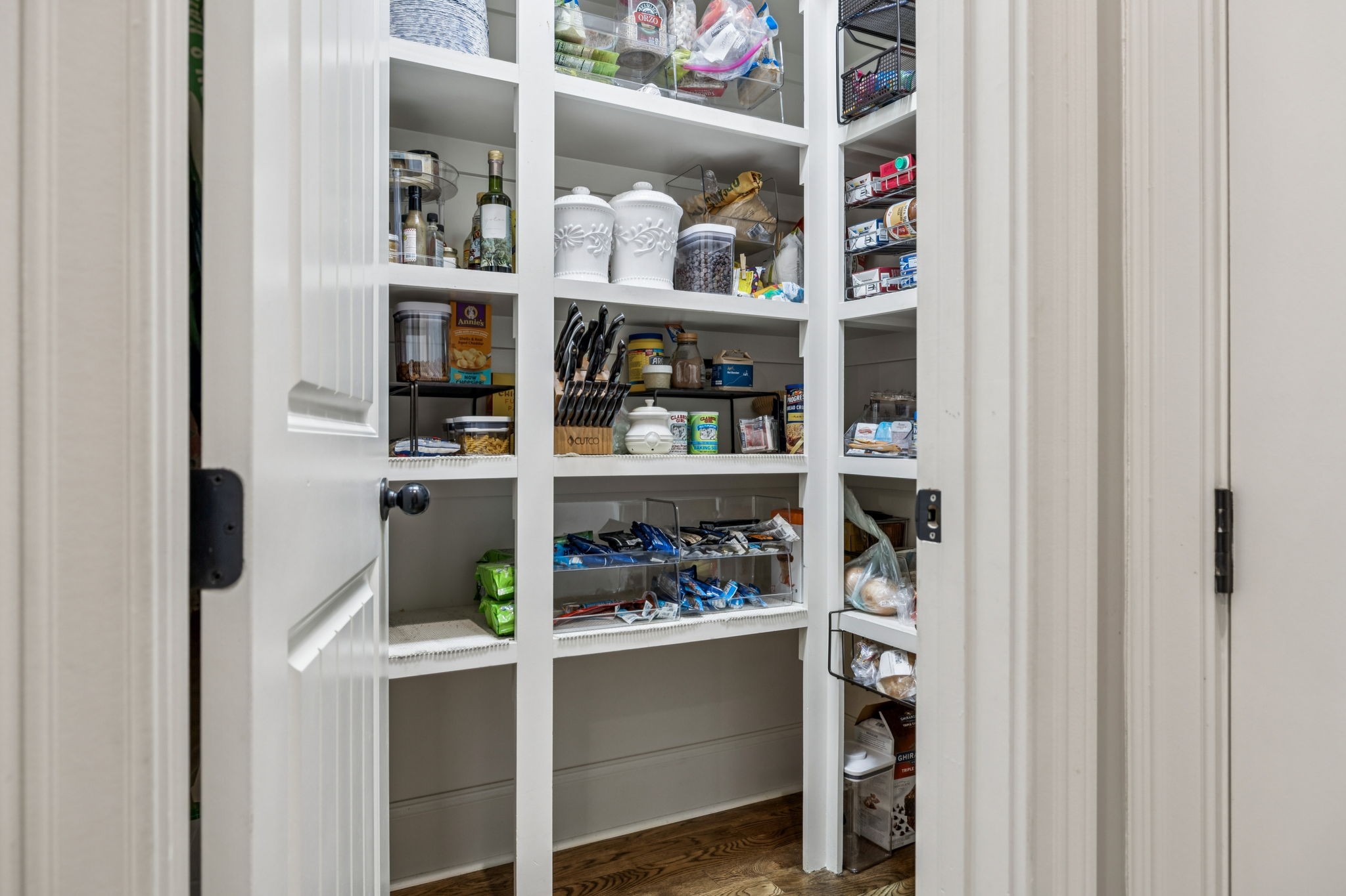 240 Laycrest Drive Mount Juliet, TN 37122 - Photo 40 of 100 a kitchen with a lot of shelves and a wooden floor
