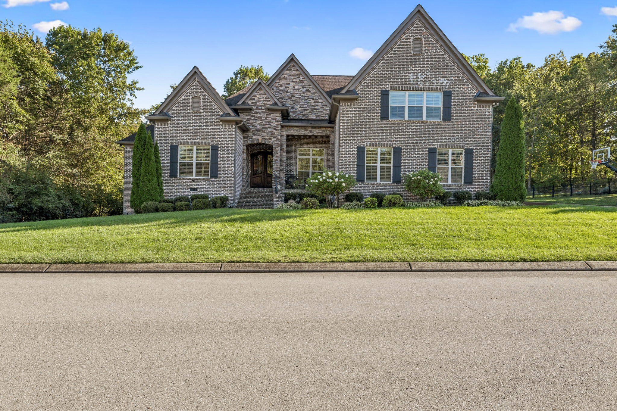 240 Laycrest Drive Mount Juliet, TN 37122 - Photo 6 of 100 a front view of a house with a yard and garage