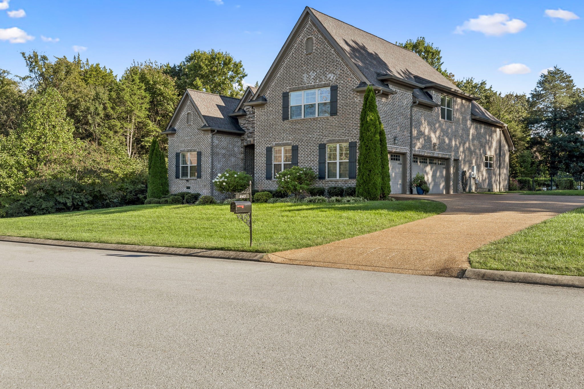 240 Laycrest Drive Mount Juliet, TN 37122 - Photo 7 of 100 a view of a big house with a big yard and large trees