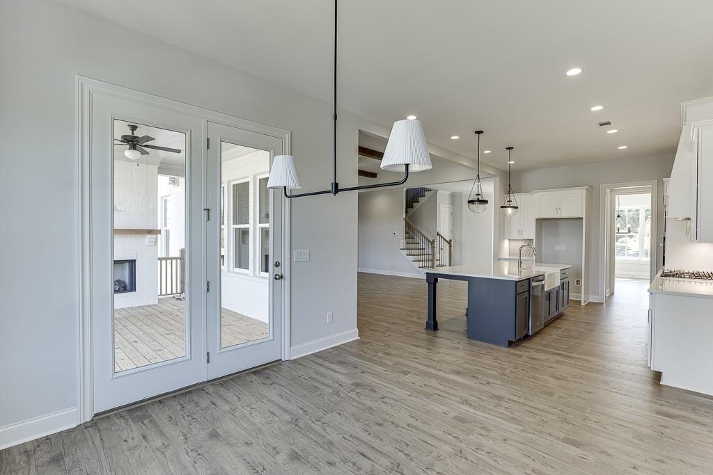 446 Thunder Road Buford, GA 30518 - Photo 17 of 79 a view of kitchen with stainless steel appliances kitchen island a refrigerator and a view of living room