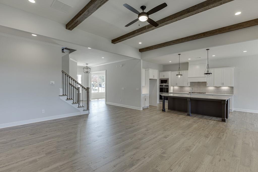 446 Thunder Road Buford, GA 30518 - Photo 22 of 79 a view of kitchen with sink and wooden floor