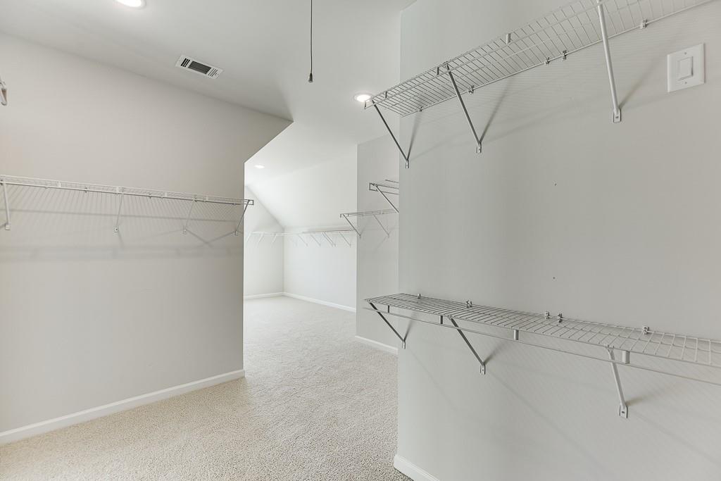 446 Thunder Road Buford, GA 30518 - Photo 45 of 79 a view of a room with racks on the wall