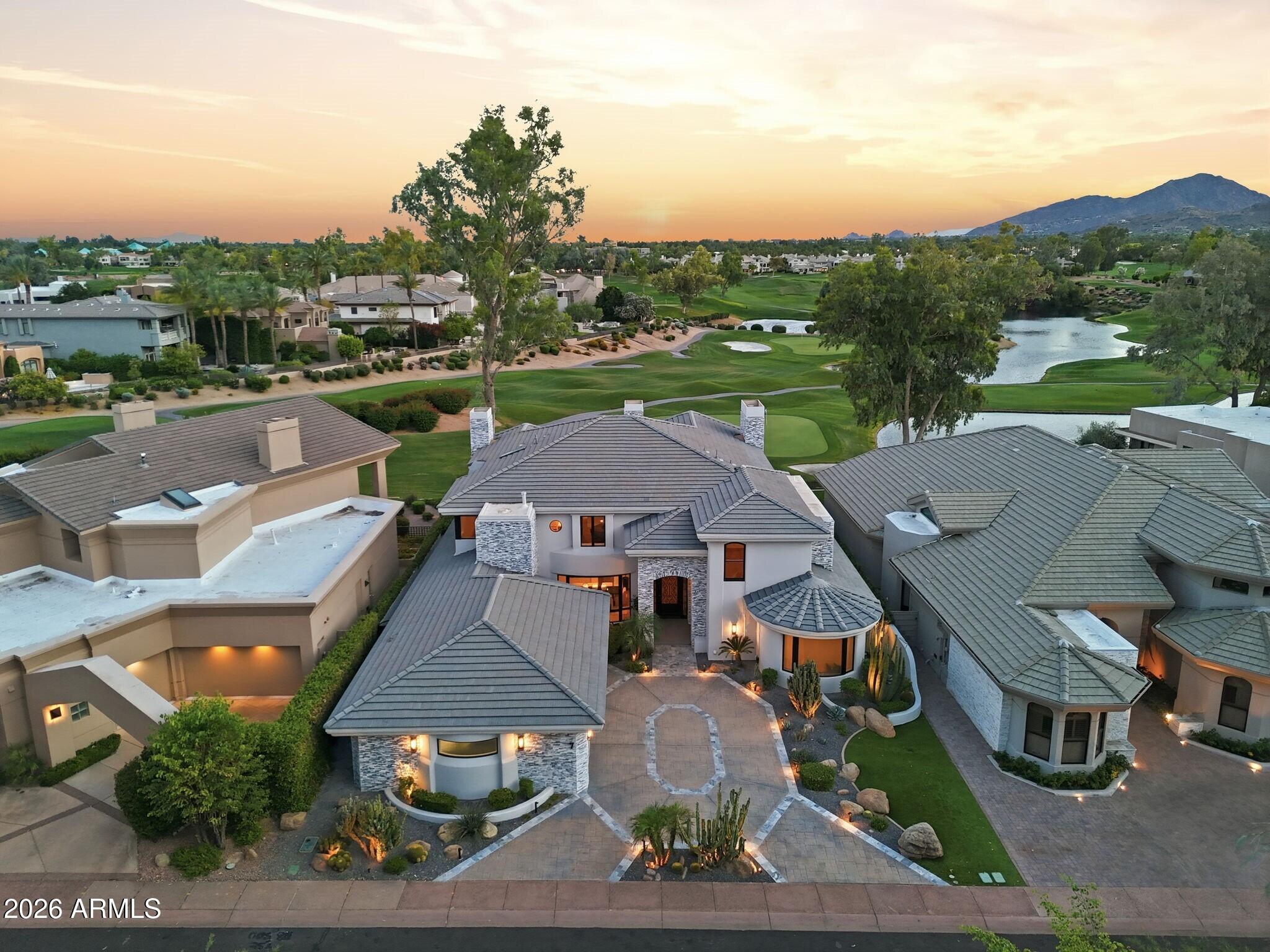 7475 East Gainey Ranch Road, Unit 7 Scottsdale, AZ 85258 - Photo 6 of 77 an aerial view of residential houses with outdoor space and street view
