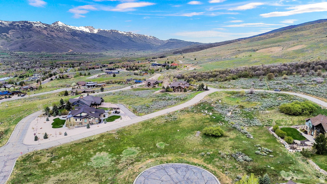 3722 Porcupine Ridge Drive, Unit 105 Eden, UT 84310 - Photo 13 of 22 Aerial view of residential area featuring a mountain backdrop
