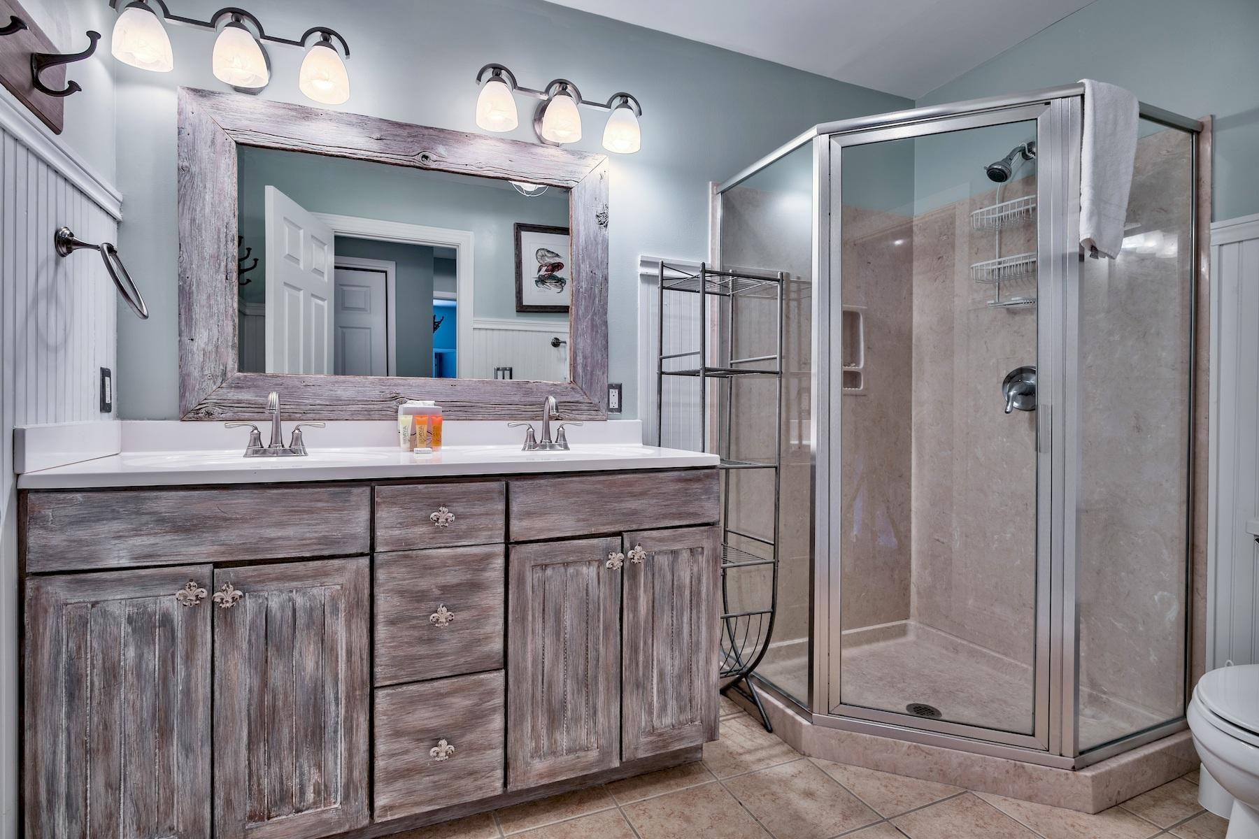 716 Sandpiper Drive, Unit 10508 Miramar Beach, FL 32550 - Photo 11 of 22 a bathroom with a double vanity sink mirror and shower