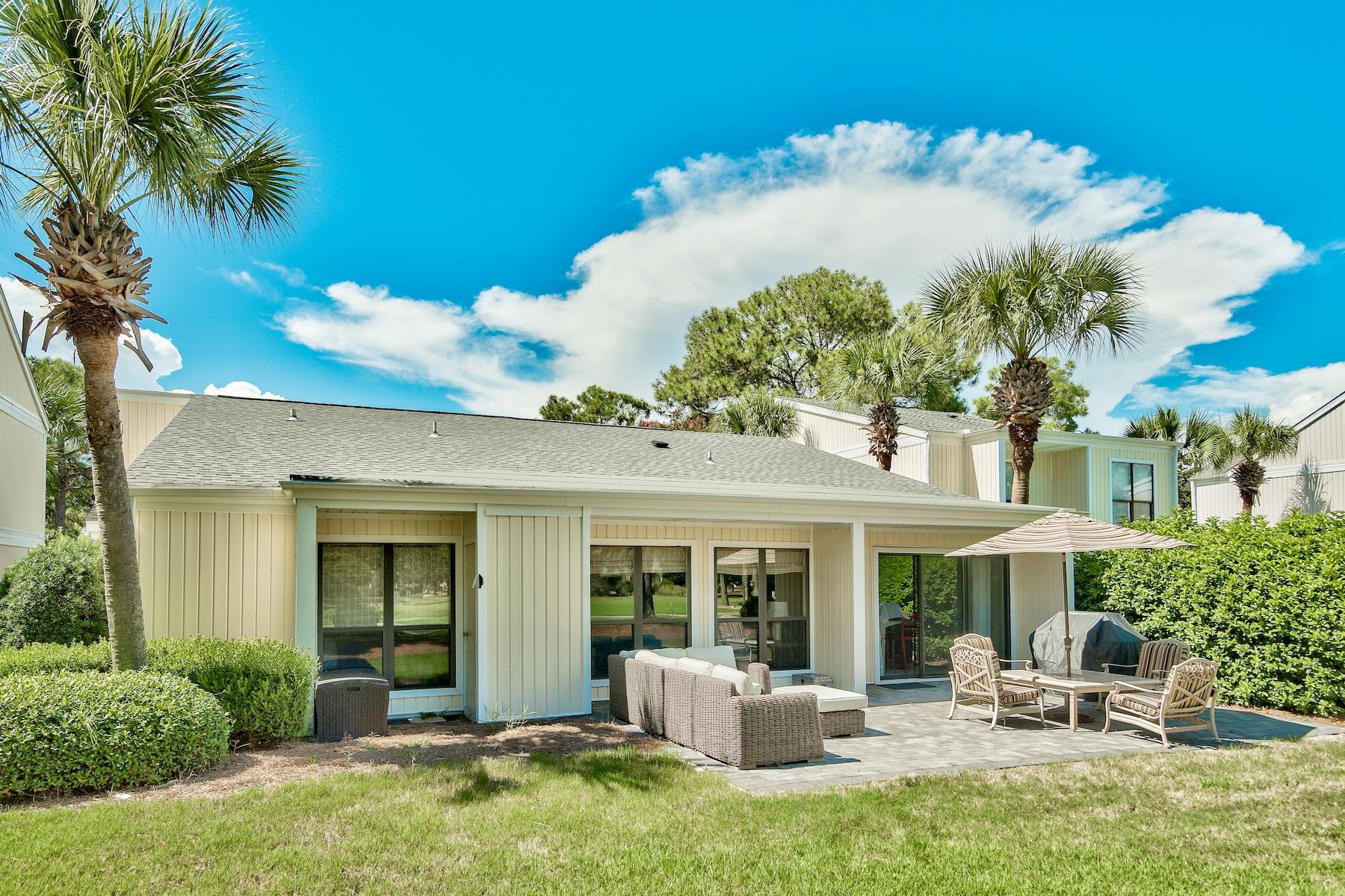 716 Sandpiper Drive, Unit 10508 Miramar Beach, FL 32550 - Photo 21 of 22 a view of a house with backyard porch and patio
