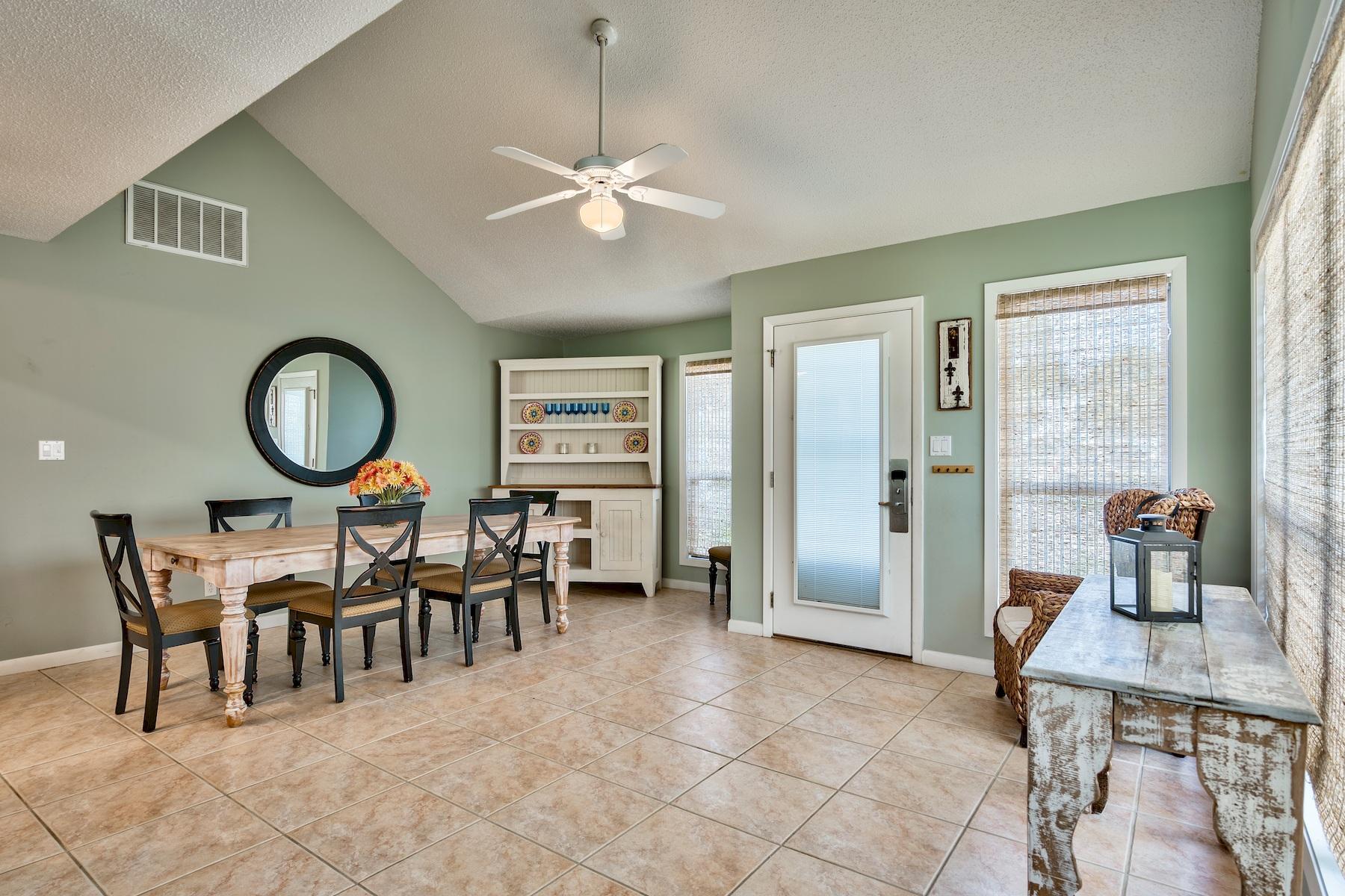 716 Sandpiper Drive, Unit 10508 Miramar Beach, FL 32550 - Photo 7 of 22 a living room with furniture a window and a chandelier