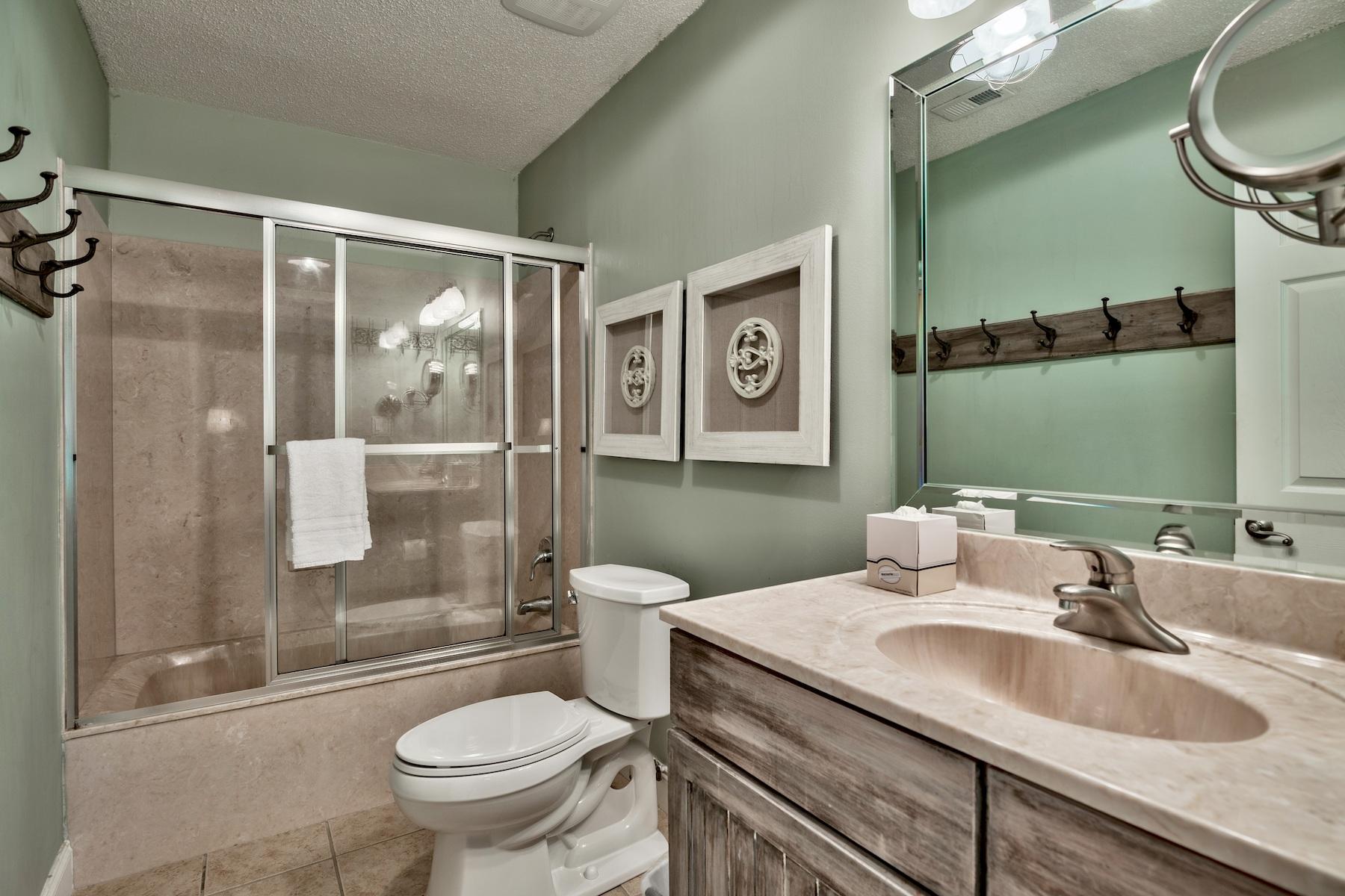 716 Sandpiper Drive, Unit 10508 Miramar Beach, FL 32550 - Photo 9 of 22 a bathroom with a sink toilet and shower