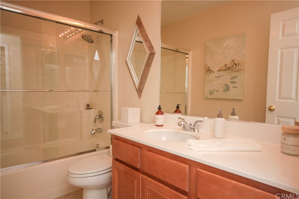 1836 Willow Bluff Drive Corona, CA 92883 - Photo 11 of 64 a bathroom with a sink a toilet and shower