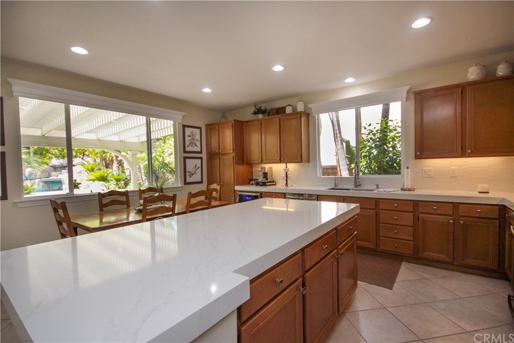 1836 Willow Bluff Drive Corona, CA 92883 - Photo 14 of 64 a large kitchen with kitchen island granite countertop a large window
