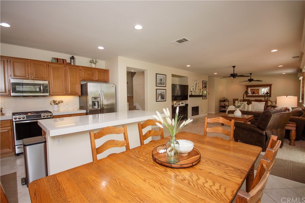 1836 Willow Bluff Drive Corona, CA 92883 - Photo 17 of 64 a kitchen with a table and chairs
