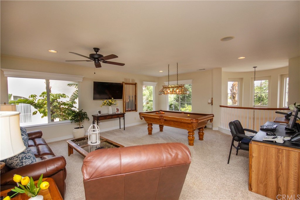 1836 Willow Bluff Drive Corona, CA 92883 - Photo 25 of 64 a living room with furniture and a flat screen tv