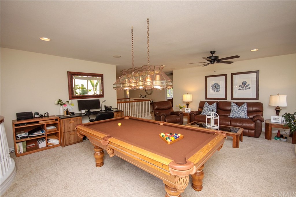 1836 Willow Bluff Drive Corona, CA 92883 - Photo 26 of 64 a living room with furniture a chandelier and pool table