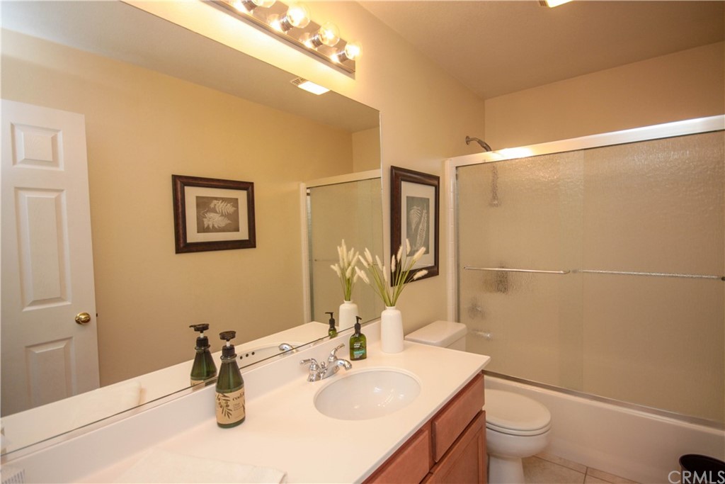 1836 Willow Bluff Drive Corona, CA 92883 - Photo 31 of 64 a bathroom with a sink toilet and shower