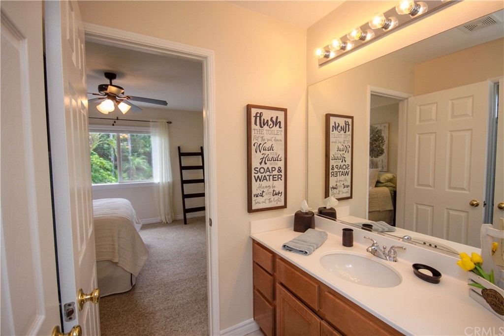 1836 Willow Bluff Drive Corona, CA 92883 - Photo 37 of 64 a bathroom with a sink double vanity and a mirror