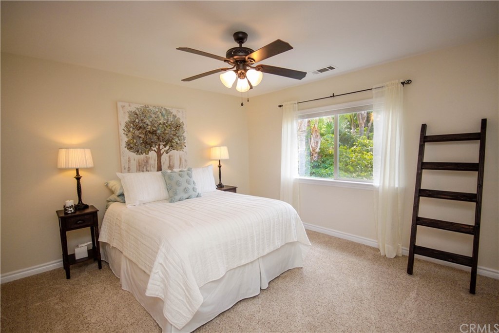 1836 Willow Bluff Drive Corona, CA 92883 - Photo 39 of 64 a bedroom with a bed and a window