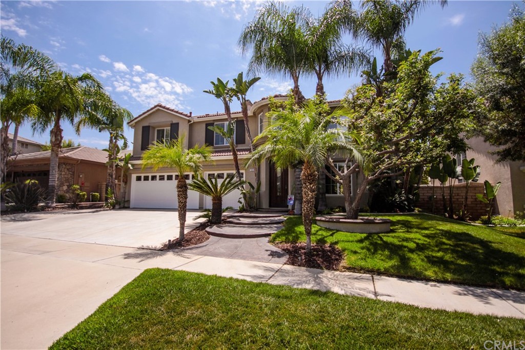 1836 Willow Bluff Drive Corona, CA 92883 - Photo 4 of 64 a front view of multiple houses with yard