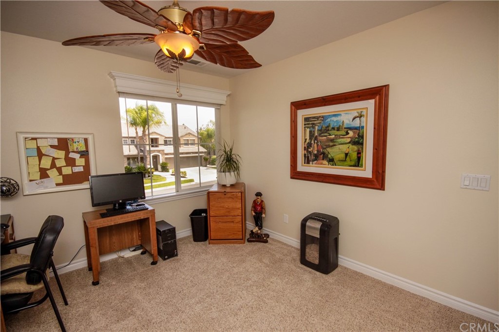 1836 Willow Bluff Drive Corona, CA 92883 - Photo 41 of 64 a view of a workspace with furniture and a window