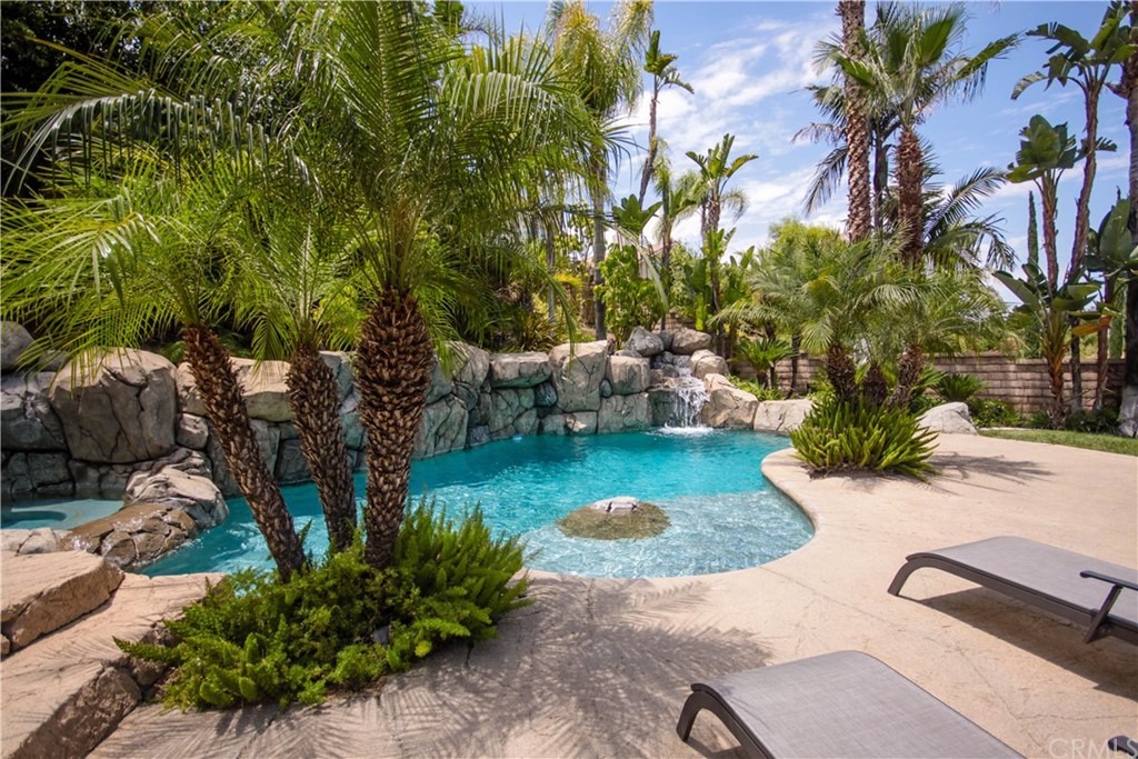 1836 Willow Bluff Drive Corona, CA 92883 - Photo 44 of 64 a view of a backyard with plants and a garden