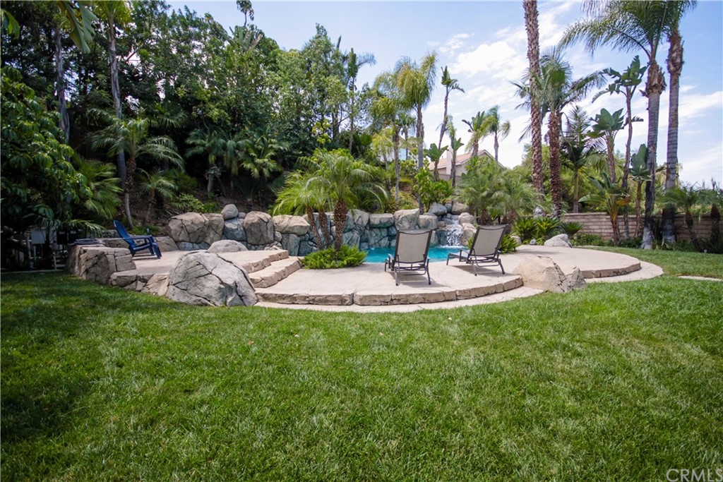 1836 Willow Bluff Drive Corona, CA 92883 - Photo 45 of 64 a view of a fountain in the backyard of a house