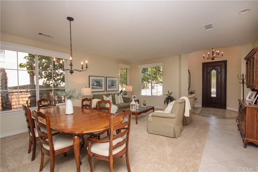 1836 Willow Bluff Drive Corona, CA 92883 - Photo 5 of 64 a view of a dining room with furniture window and outside view