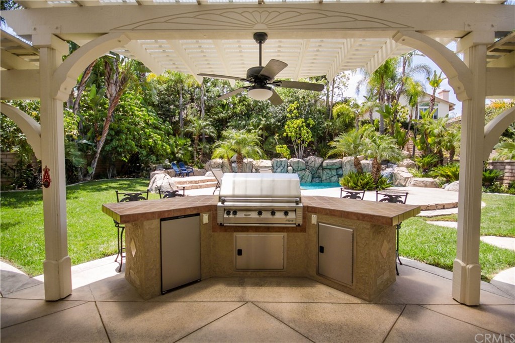 1836 Willow Bluff Drive Corona, CA 92883 - Photo 51 of 64 a kitchen with a sink and a stove