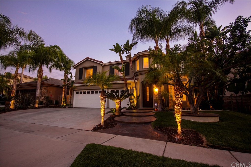 1836 Willow Bluff Drive Corona, CA 92883 - Photo 52 of 64 a front view of a house with a yard