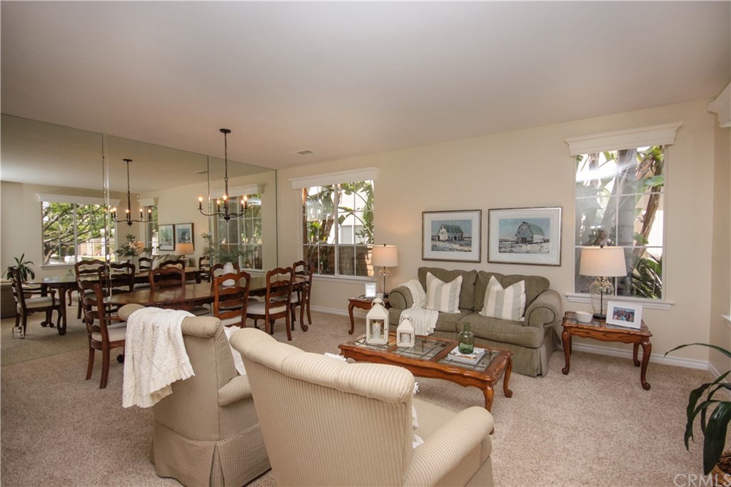 1836 Willow Bluff Drive Corona, CA 92883 - Photo 6 of 64 a living room with furniture and a chandelier