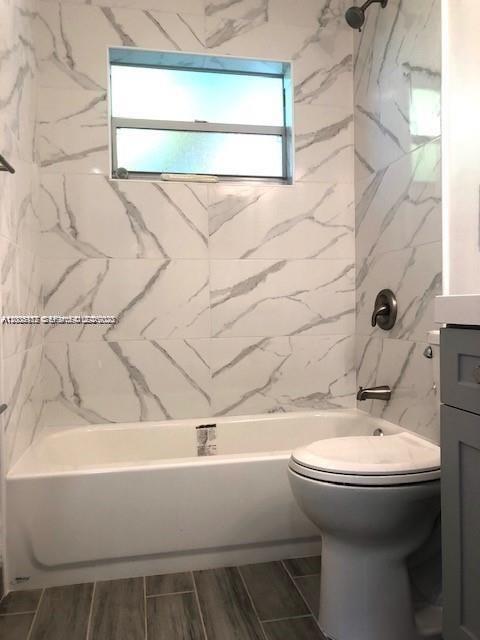215 Southwest 10th Street Hallandale Beach, FL 33009 - Photo 9 of 14 a bathroom with a sink and toilet