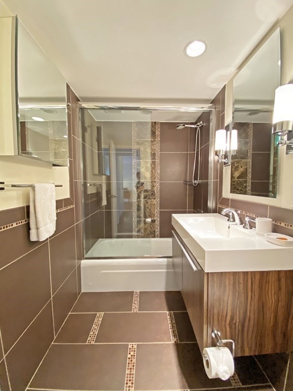 111 Perkins Street, Unit 186 Boston, MA 02130 - Photo 18 of 34 a bathroom with a sink a toilet and shower