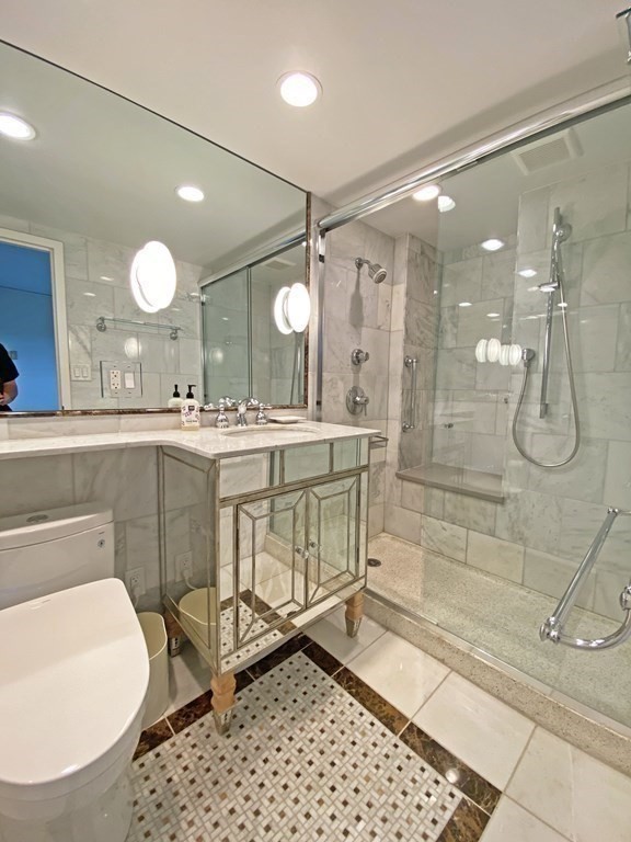 111 Perkins Street, Unit 186 Boston, MA 02130 - Photo 19 of 34 a bathroom with a sink mirror and a shower